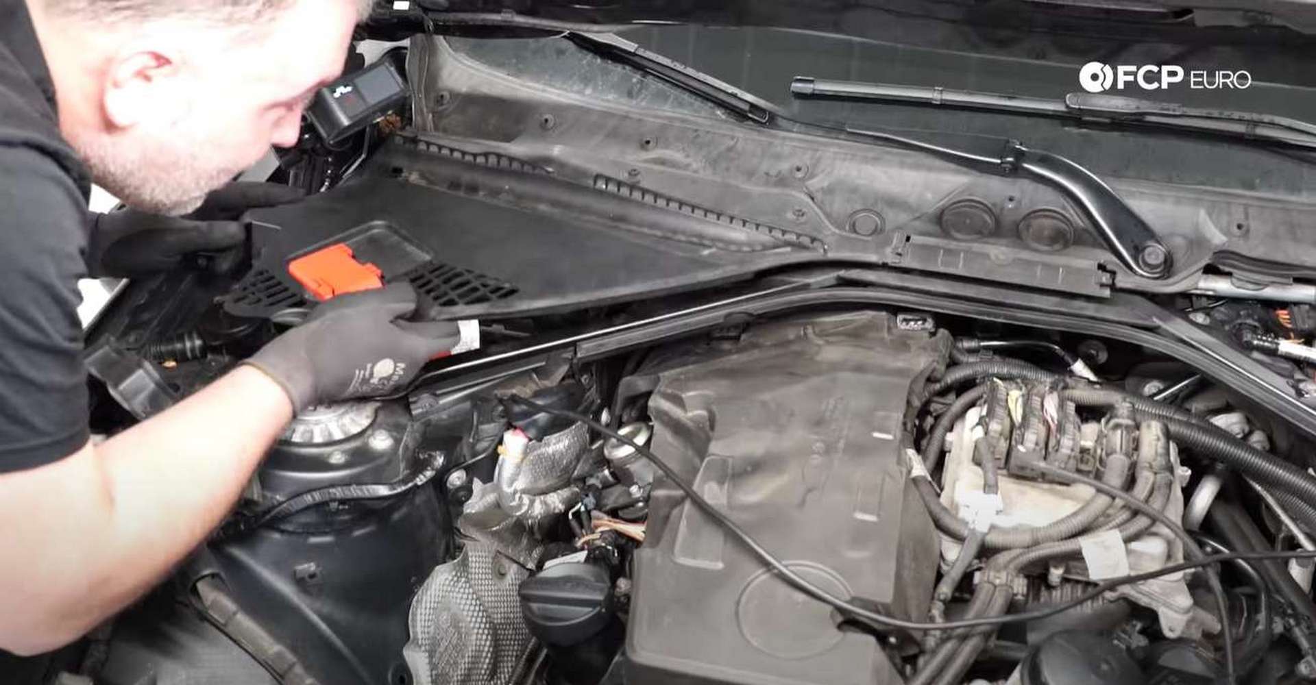 DIY BMW F30 Fuel Injector Replacement refitting the upper cowl pieces