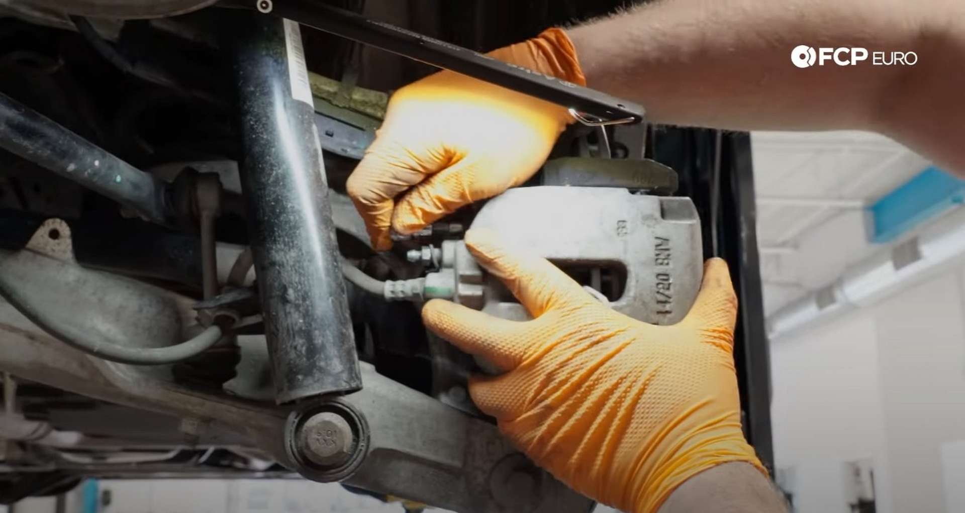 DIY BMW F15 X5 F16 X6 Brake Service refitting the caliper to the knuckle
