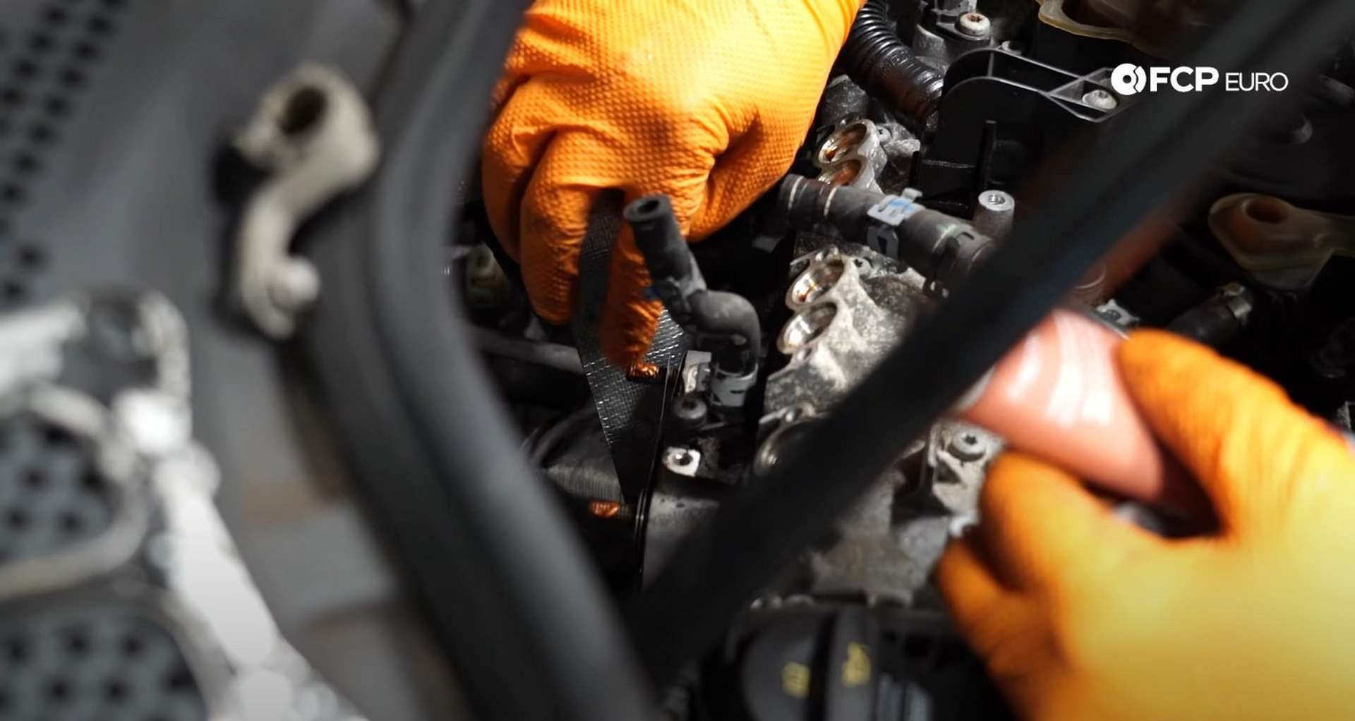 DIY MK7 VW GTI Turbocharger Upgrade applying anti-seize to the turbo mounting studs
