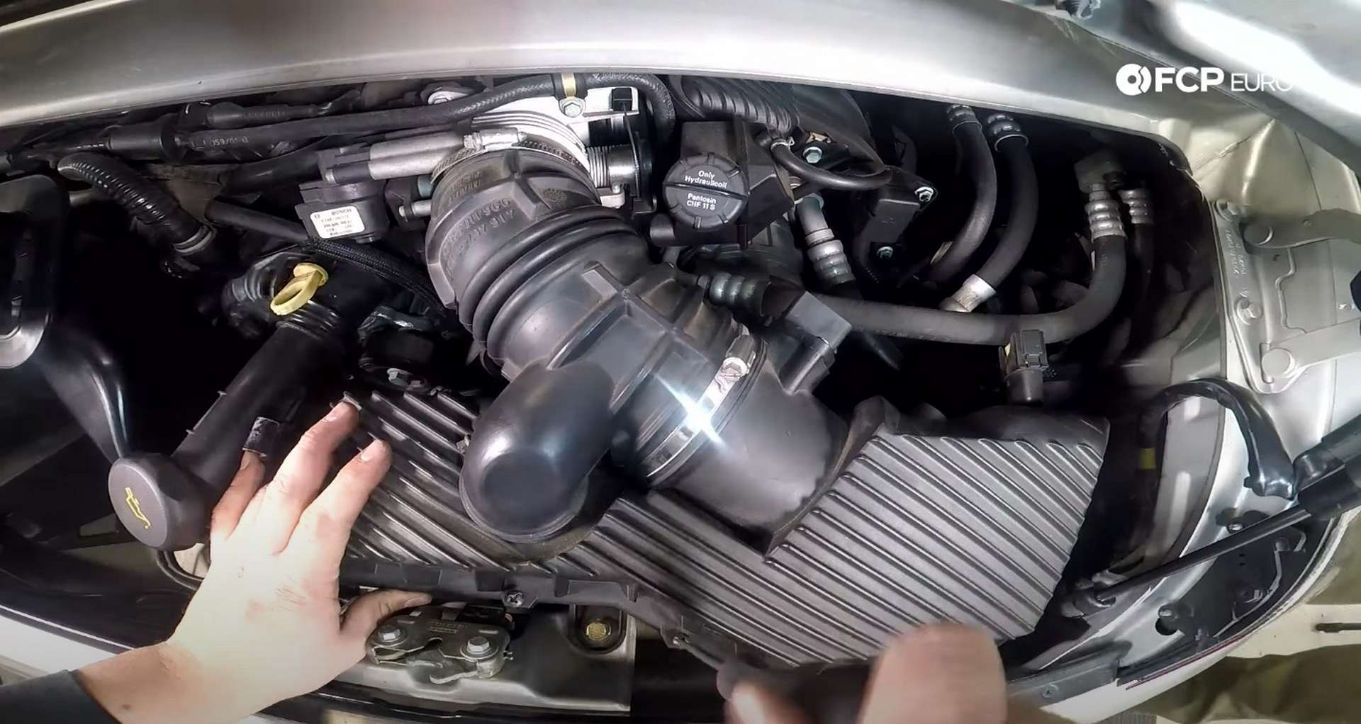 DIY Porsche 996 997 Engine Air Filter Replacement tightening the airbox cover screws