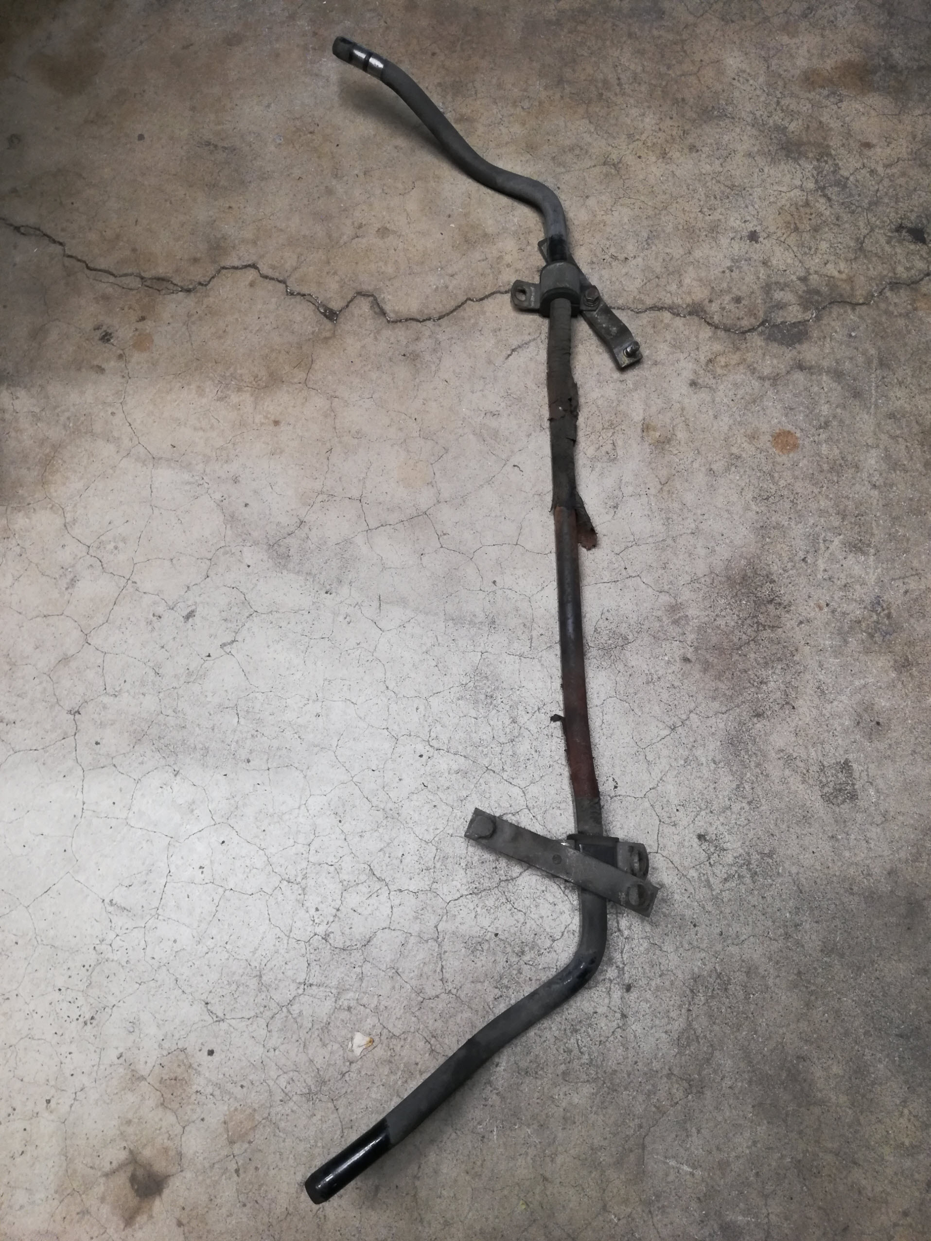 Air-cooled Porsche 911 front swaybar removed.