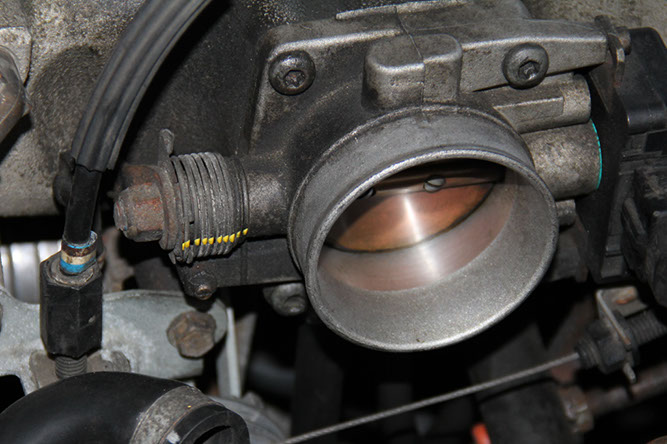 Step 1: Mark the throttle return spring
