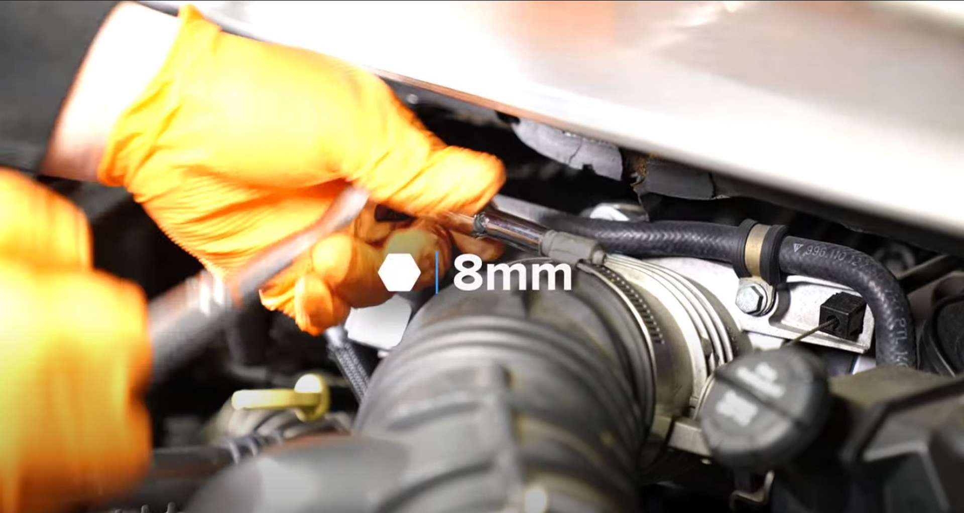 Porsche 996 Water Pump And Thermostat Replacement loosening the intake hose clamp on the throttle body