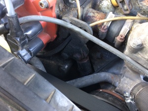 Here we see the upper shock mount for the accessory belt tensioner.