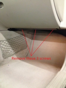Remove the screws and pull the front of the panel downward.