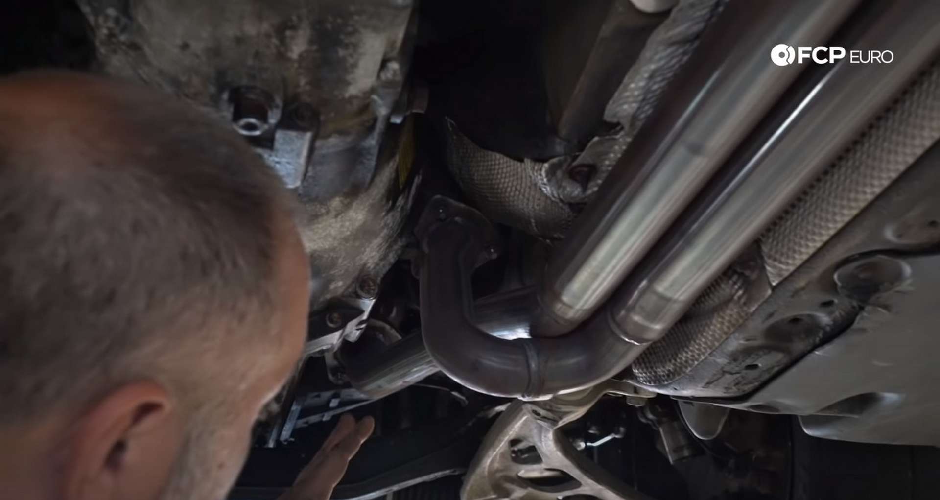 DIY BMW E46 Clutch Replacement removing the exhaust reinforcement plate