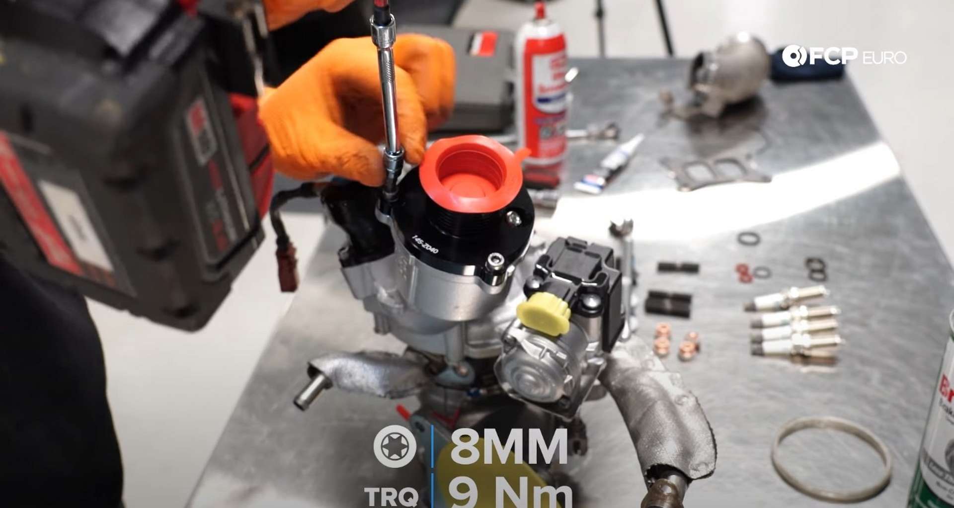 DIY MK7 VW GTI Turbocharger Upgrade tightening the turbo muffler bolts
