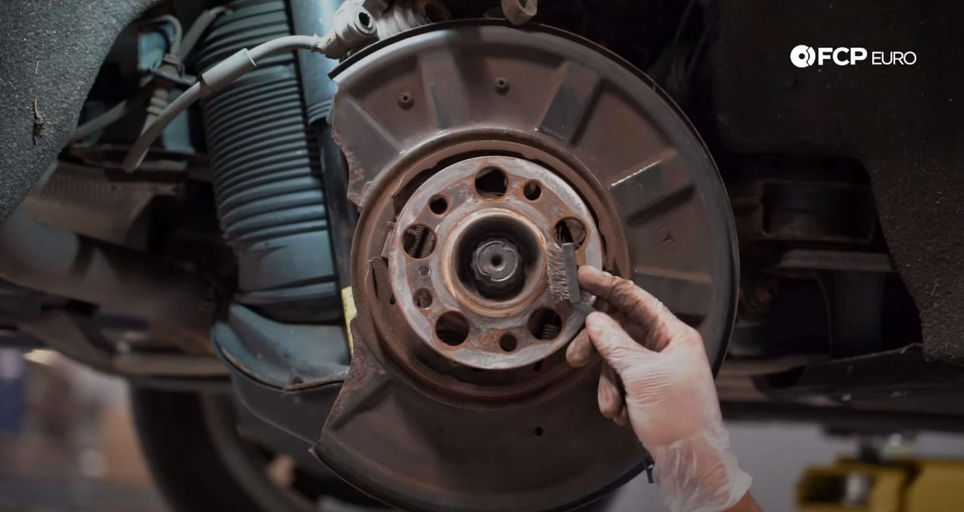 DIY Mercedes W211/212 Rear Brake Job cleaning the wheel hub face