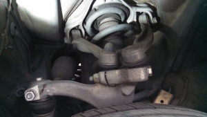 Both upper arms mount to the upright along the top edge with one bolt