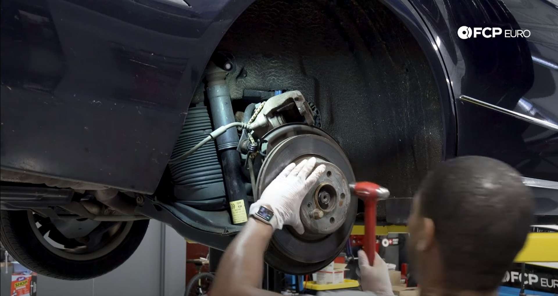 DIY Mercedes W211/212 Rear Brake Job hitting the rotor with a hammer