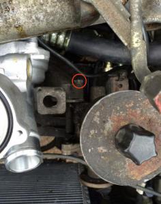 Removing the circled bolt will allow the power steering pump to tilt out of the way.