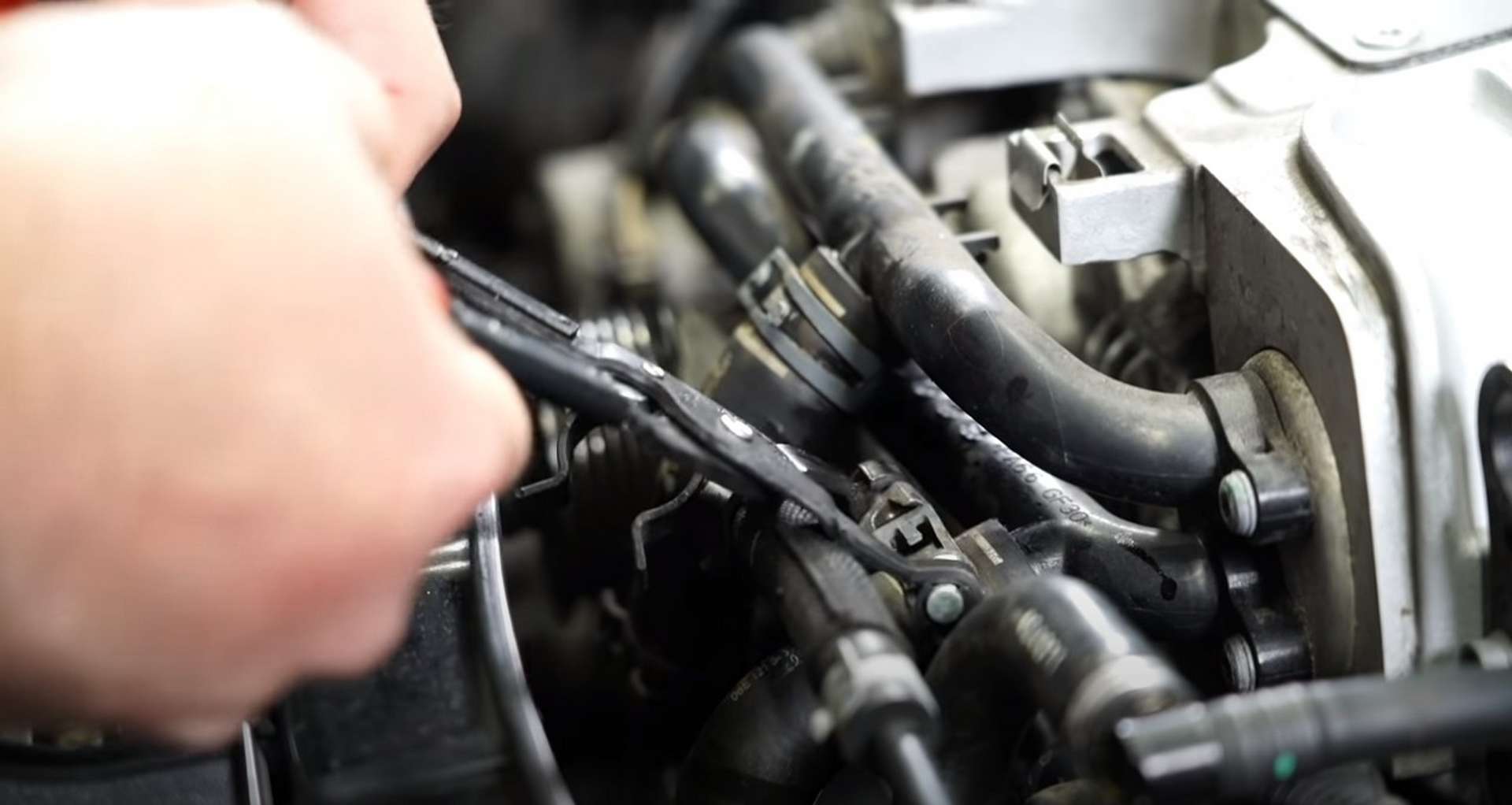 DIY Audi 3.0T Supercharger Oil Change reconnecting the coolant hoses