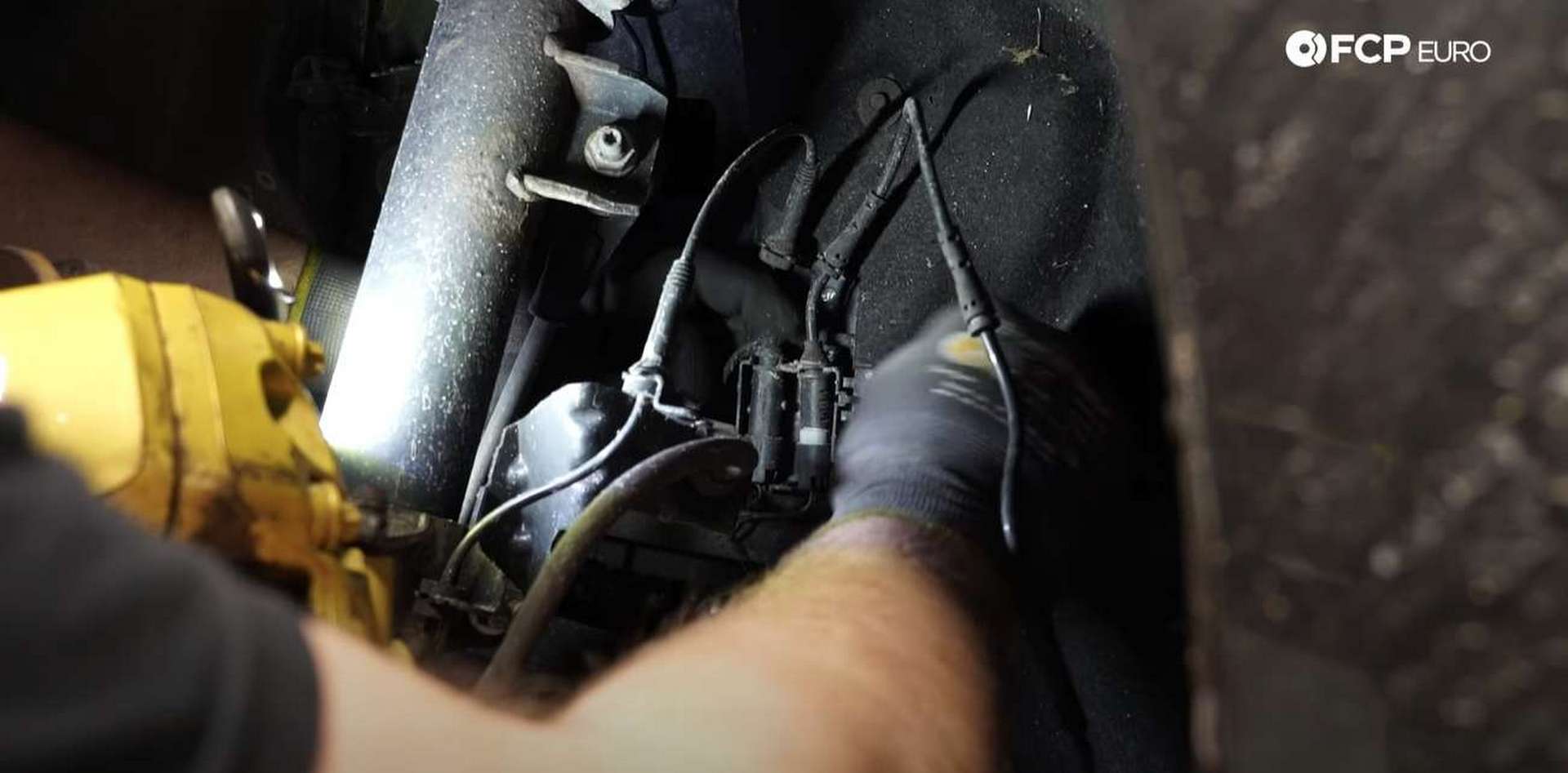 DIY BMW F30 M-Sport Brake Service disconnecting the old pad wear sensor