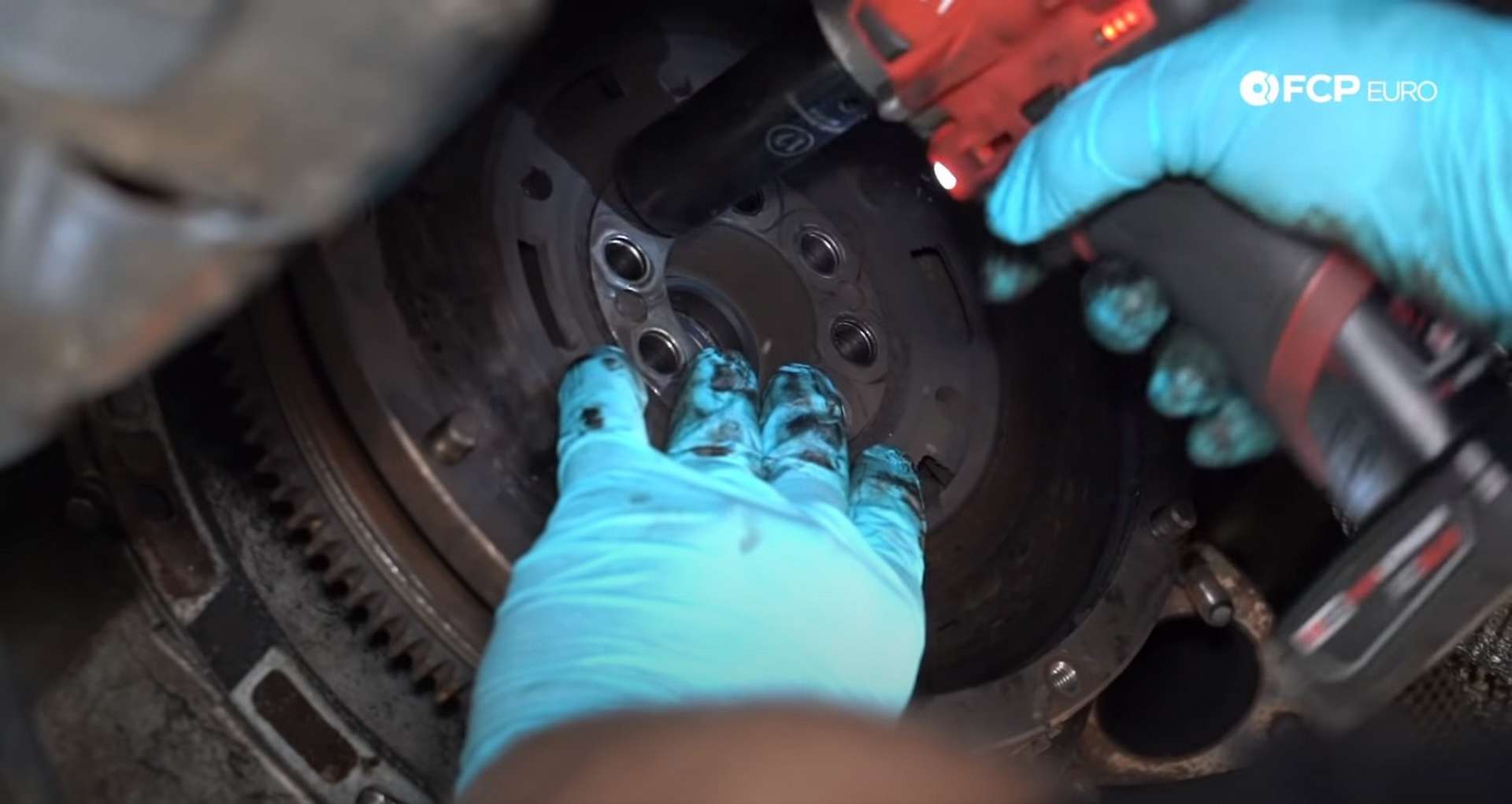 DIY BMW E46 Clutch Replacement removing the flywheel bolts