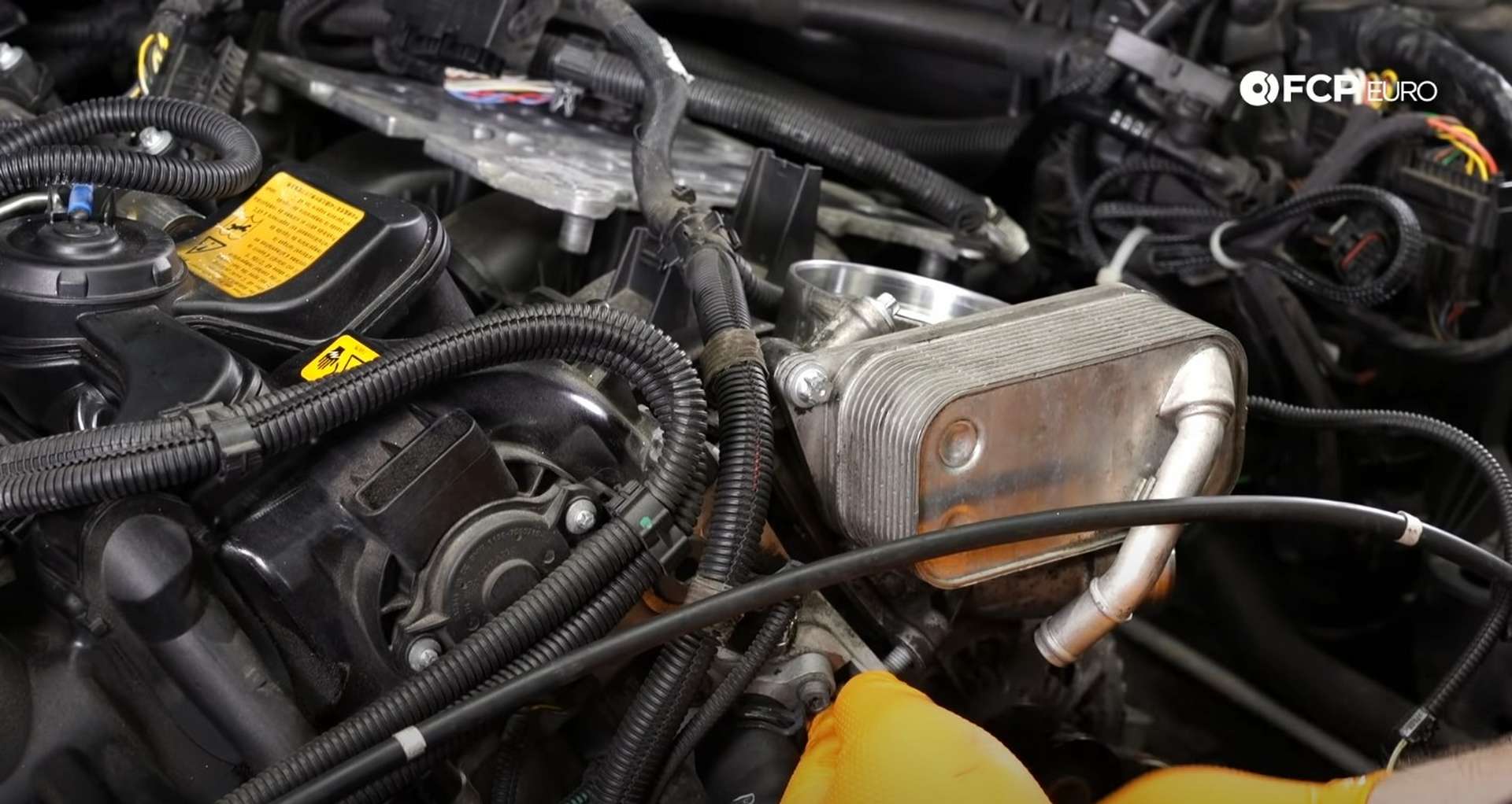 DIY BMW F30 Oil Filter Housing Gasket Replacement bolt tightening the manifold nuts