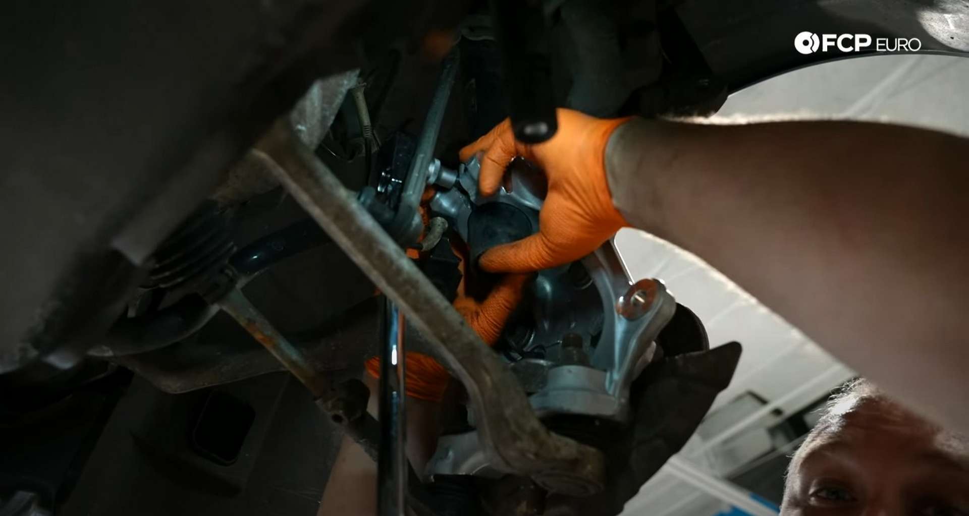 DIY BMW E9X Wheel Bearing Replacement pulling down on the knuckle