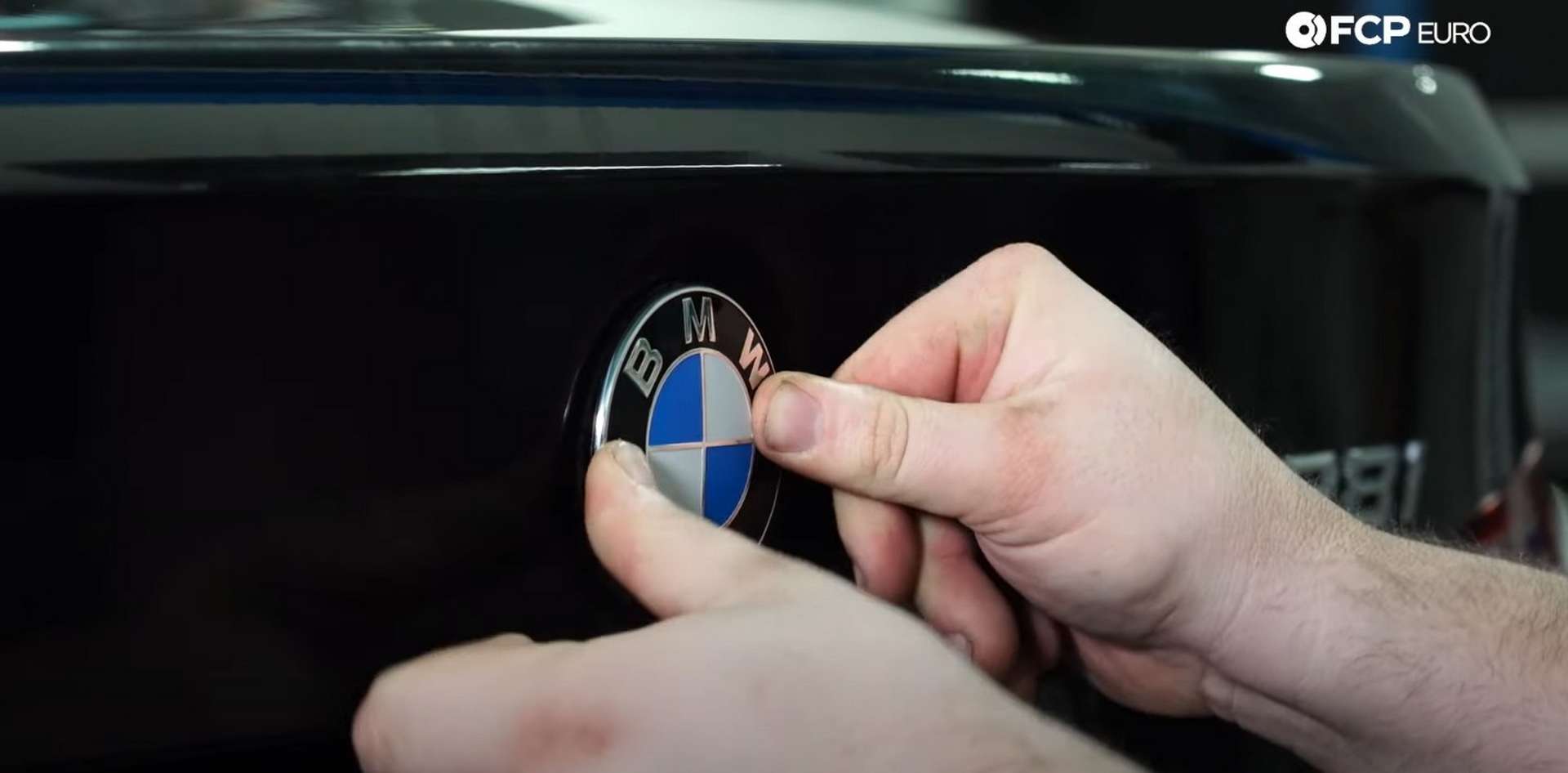 DIY BMW F30 Roundel Replacement pressing in the new emblem