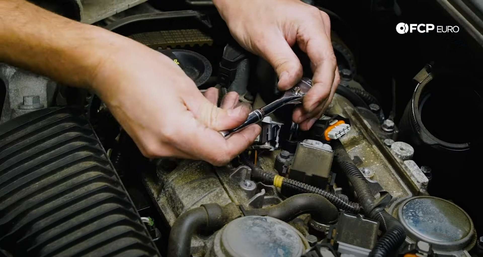 DIY Volvo Spark Plug and Ignition Coil Replacement removing the ignition coil mounting bolts