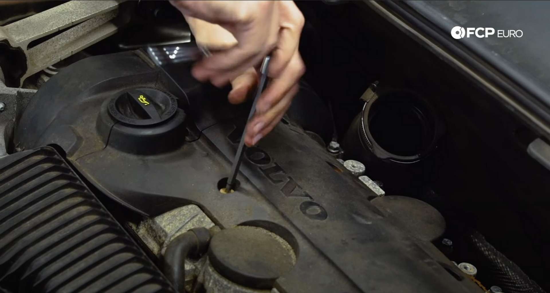 DIY Volvo Spark Plug and Ignition Coil Replacement refitting the ignition coil cover