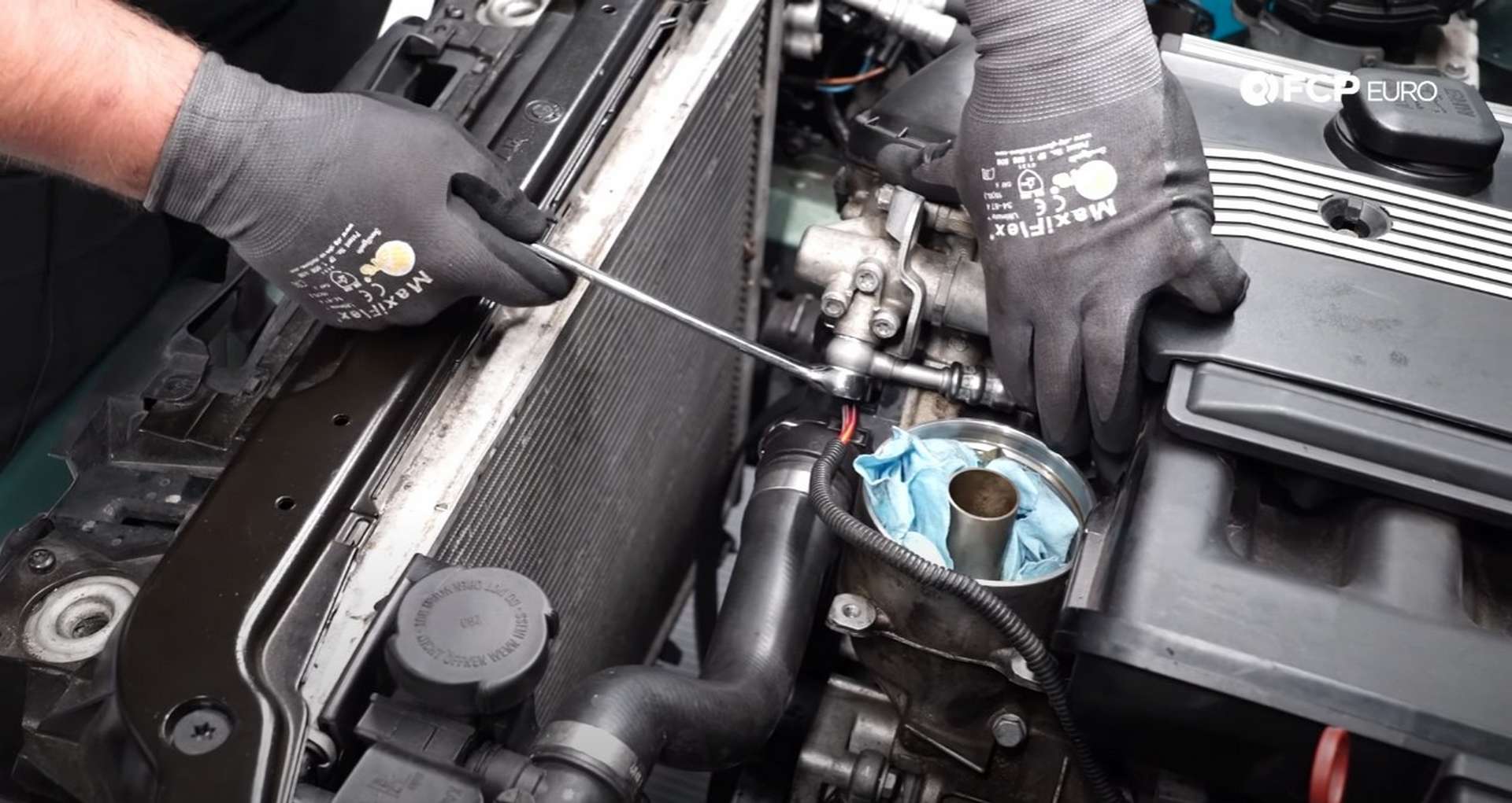 DIY BMW E46 Oil Filter Housing Gasket and VANOS Line Replacement tightening the banjo bolts