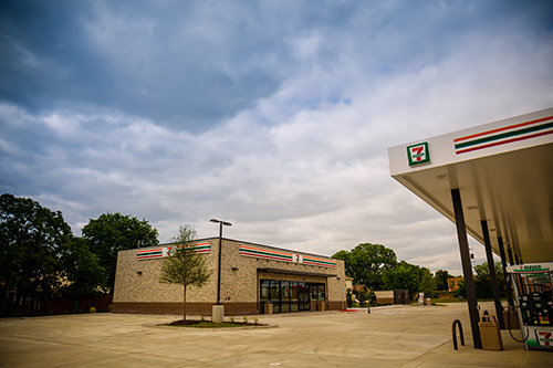 A 7-Eleven® gas pump and store during the day