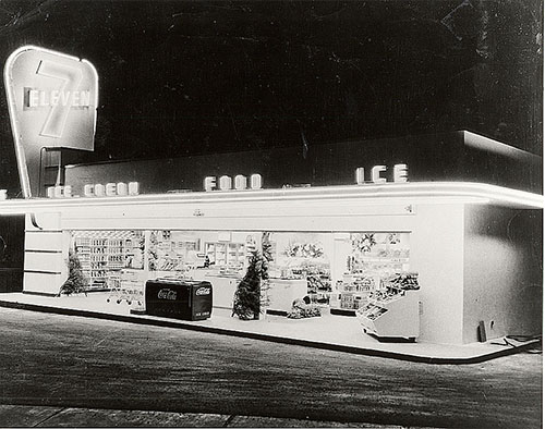 Christmas trees and a coke cooler outside a 7-Eleven