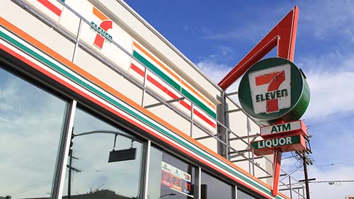 A closeup of 7-Eleven®/ATM/Liquor sign