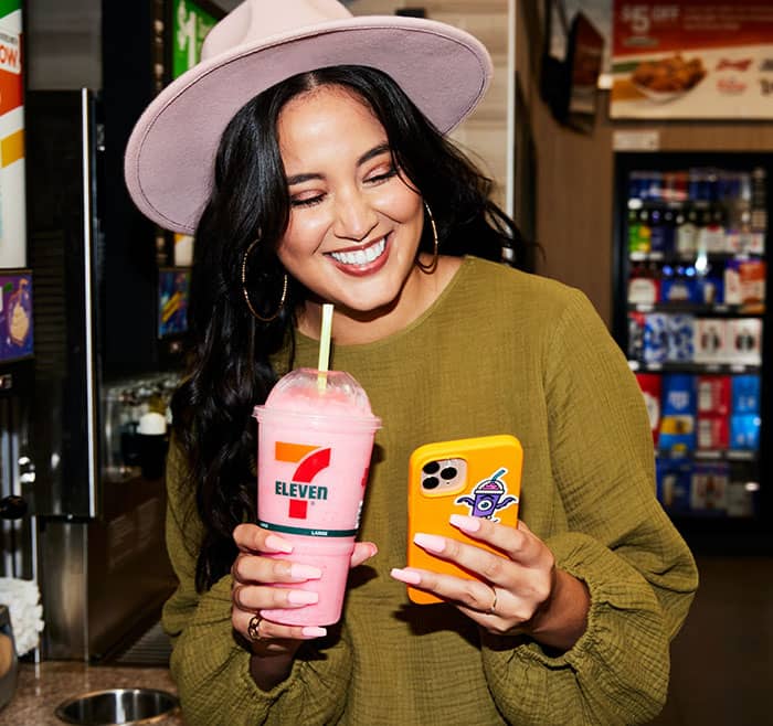 Woman smiling with a Slurpee