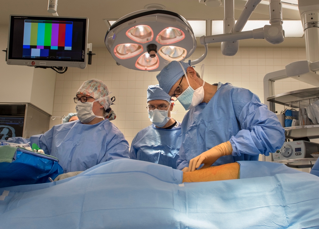 Surgeons performing heart surgery.