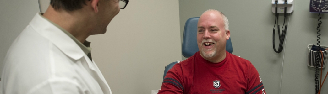 Patient smiling at his doctor