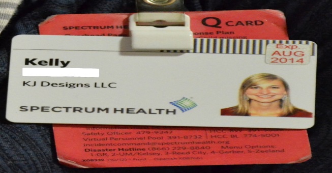 Image of Badge with Tuberculosis test expiration sticker.