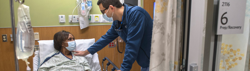 doctor talking to patient at bedside