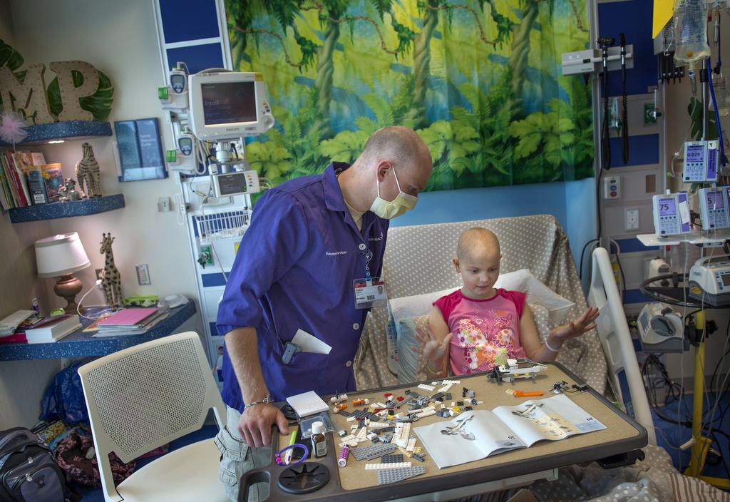 Volunteer playing with a child.