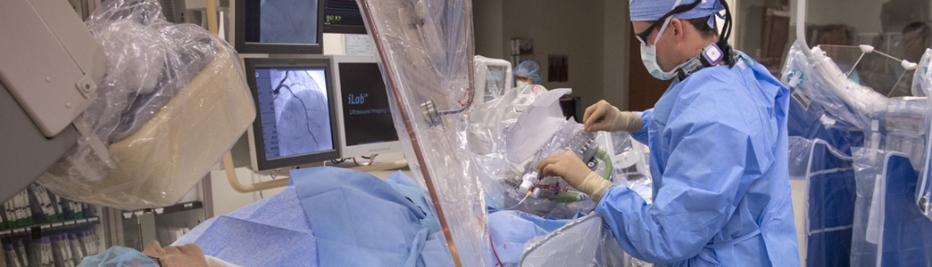 Doctor performing an interventional procedure on a patient