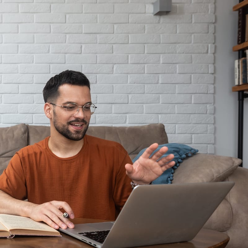 Colleagues in the office checking out Berlitz's AI tool that helps them learn to speak English confidently