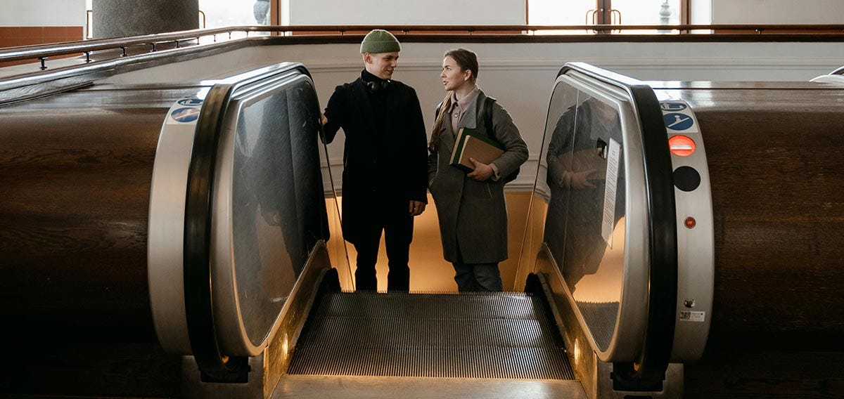 Friends standing on the stairs and talking about boundaries
