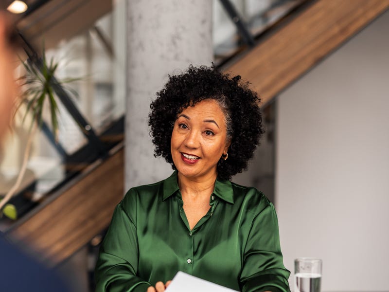 Woman talking to her instructor during an English course with Berlitz
