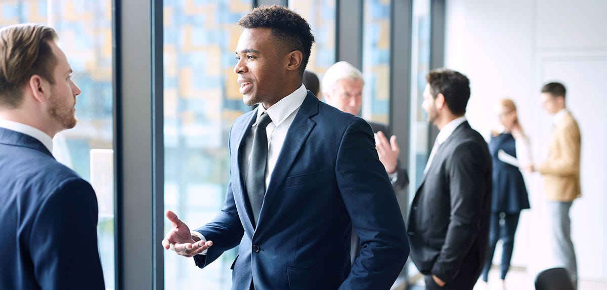 Businessmen chatting after a meeting in the appropriate tone