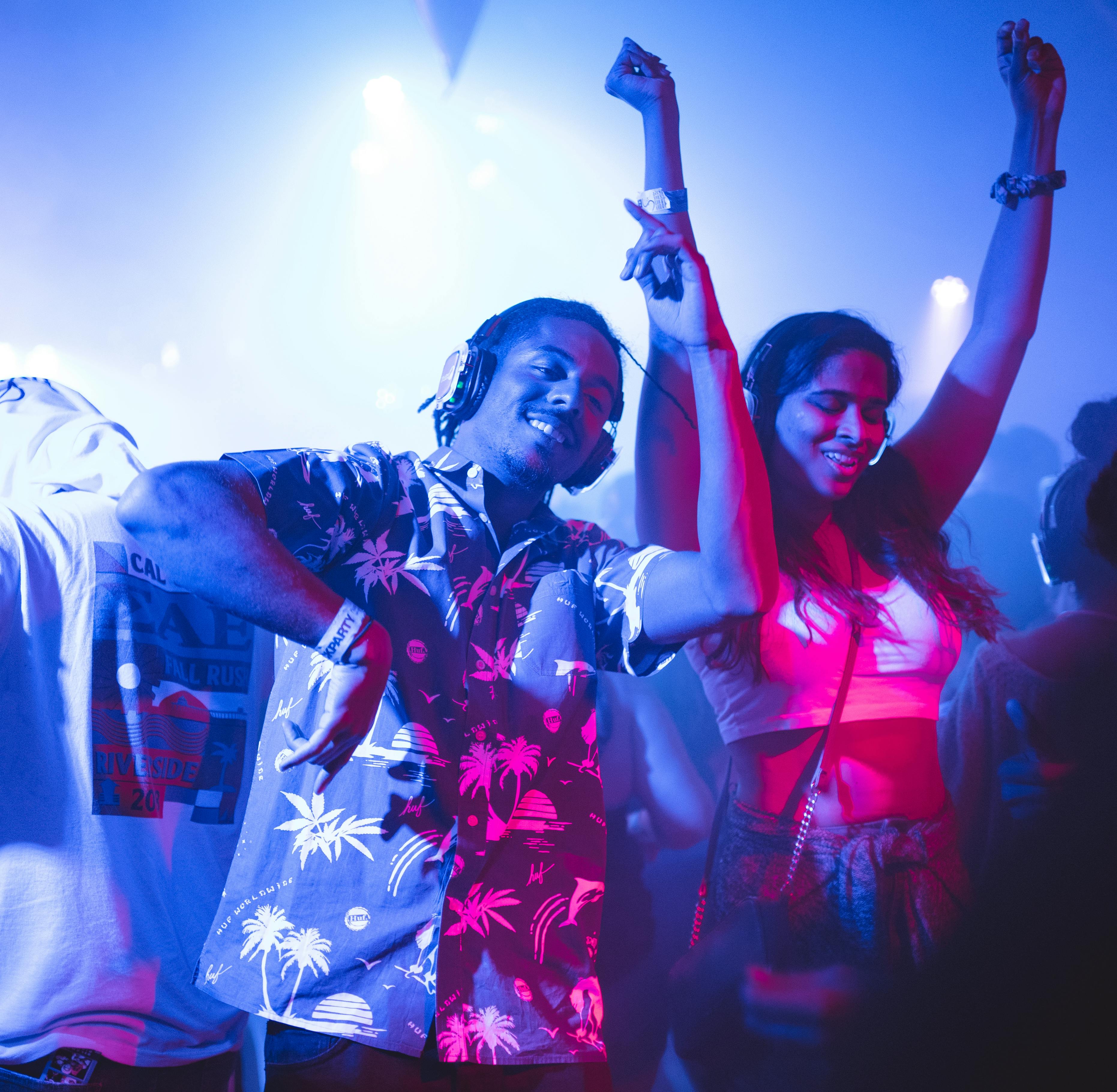 Young people dancing at night during a festival