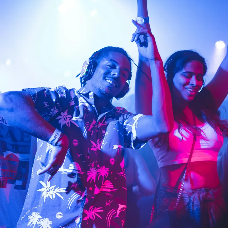 Young people dancing at night during a festival