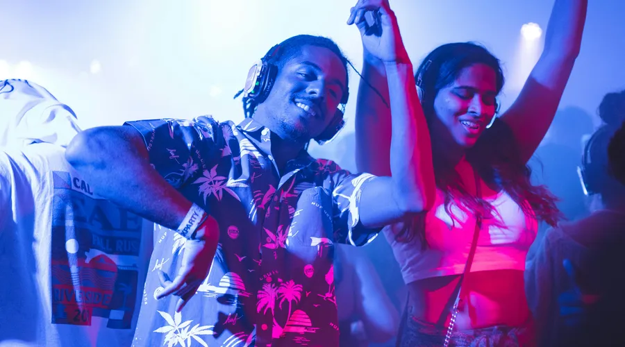 Young people dancing at night during a festival