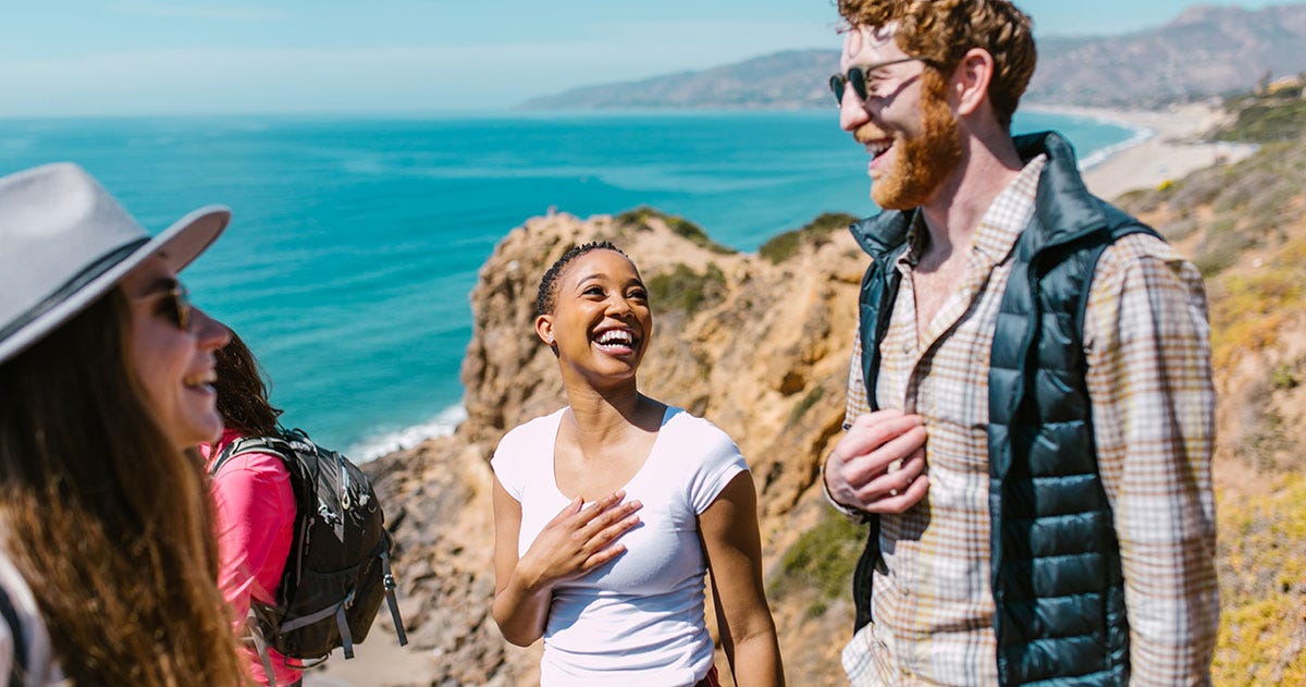 A group of friends chatting about the scenery during a holiday