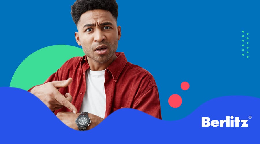 Man pointing at his watch during time vocabulary pronunciation exercises