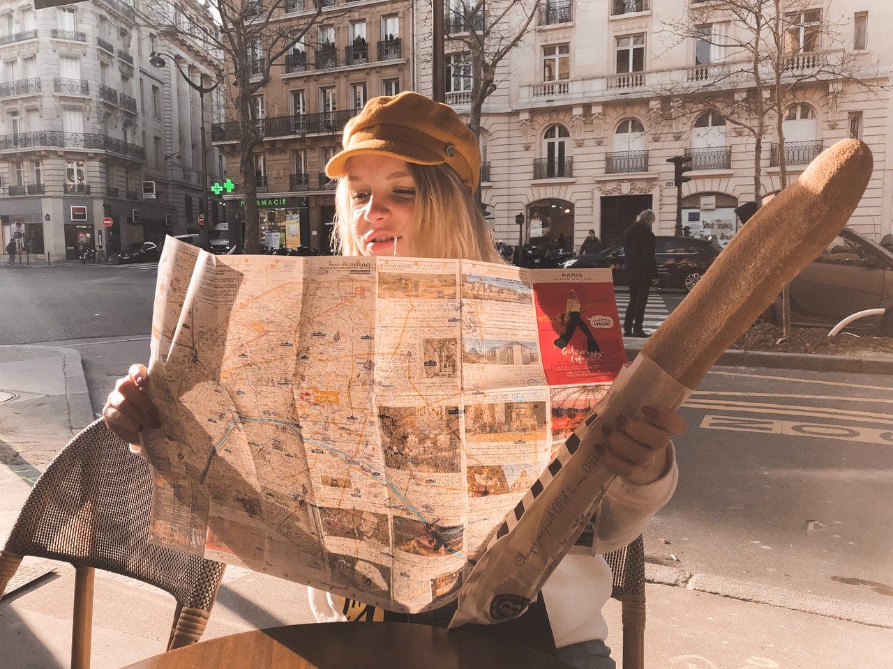 Girl holding a map of the lands where Roman languages are spoken