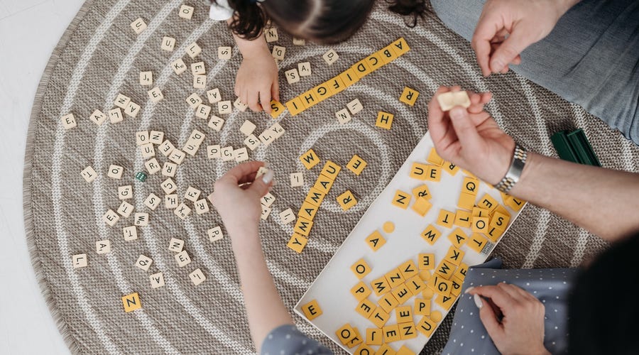 A family playing with Scrabble