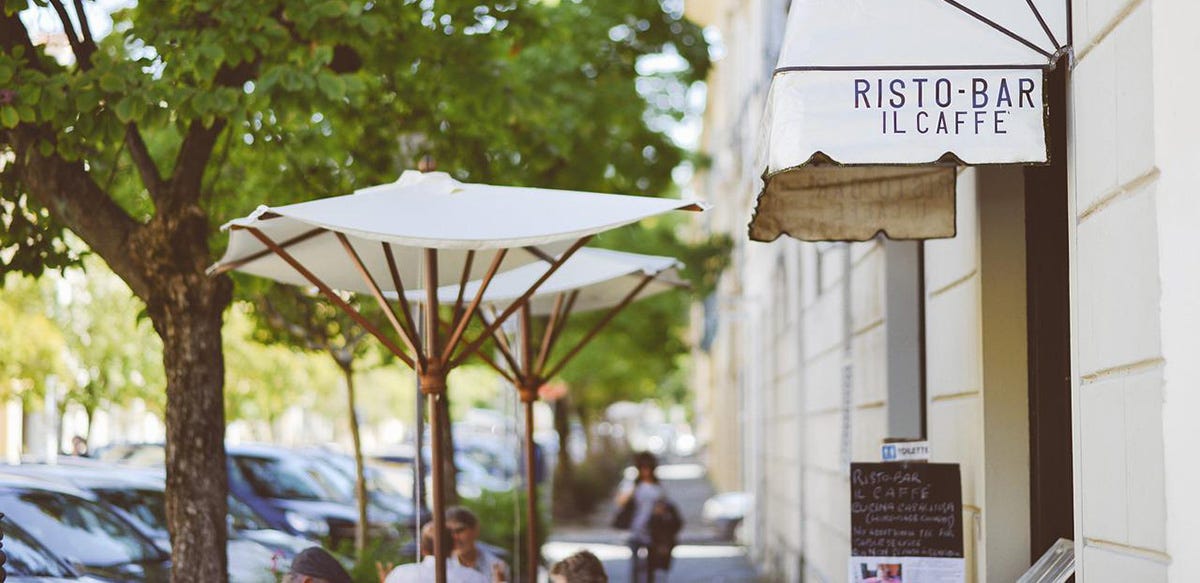 Coffee shop on the street with umbrellas