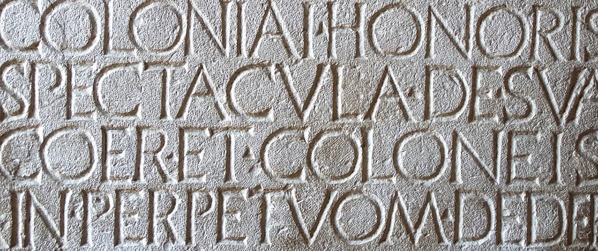 Latin writing carved into stone