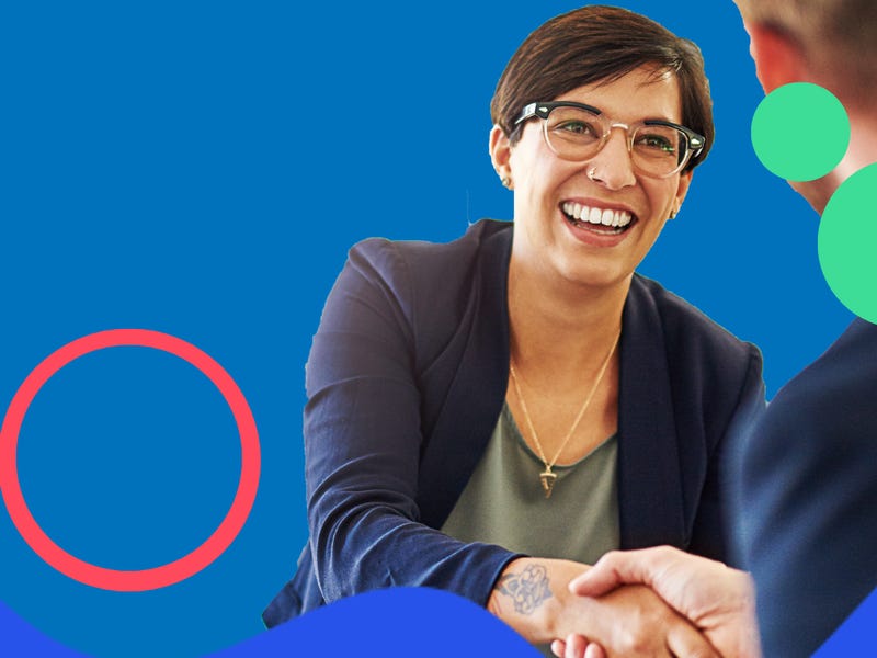 Woman shaking hands with a business partner