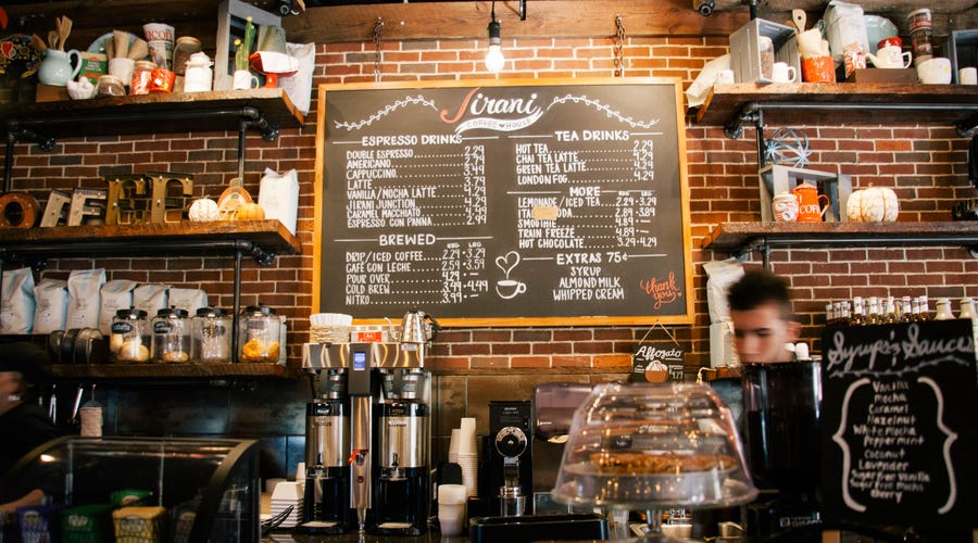 Café menu on the wall letting people know what they can order