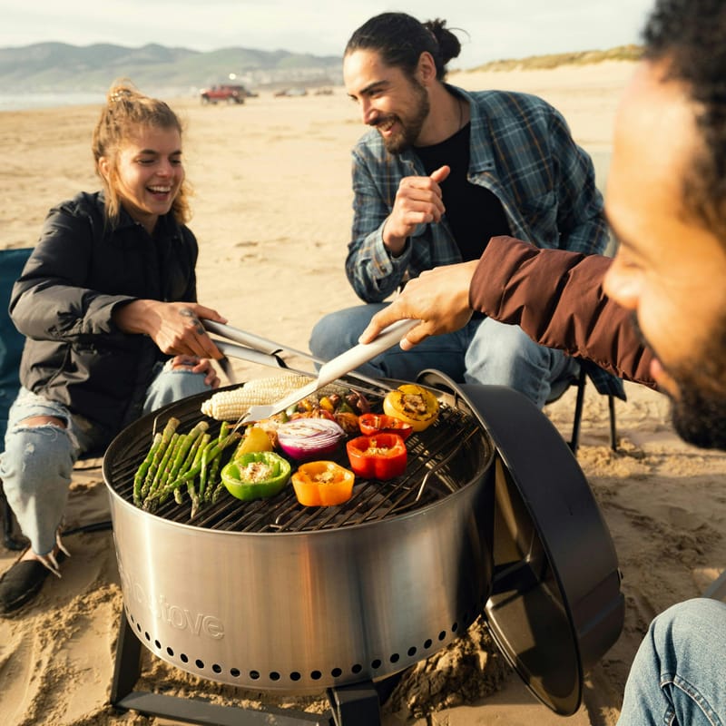 Friend group grilling on an Australian beach